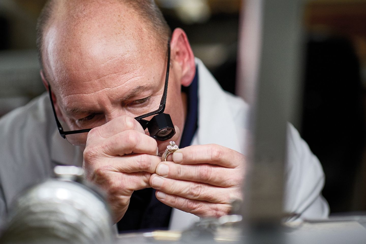 Jared jewelry expert inspecting a ring