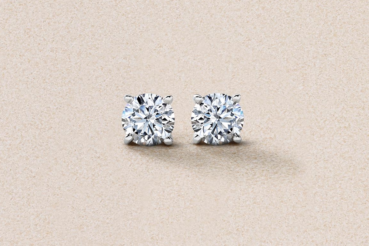 round diamond solitaire earrings